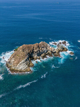 Aerial view of Ixtapa beach with a beautiful rock island and tranquil ocean, Zihuatanejo, Mexico.