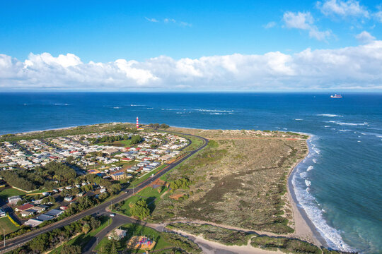 Aerial view of the beautiful coastline featuring Point Moore Lighthouse and sandy beach, Geraldton, Australia.