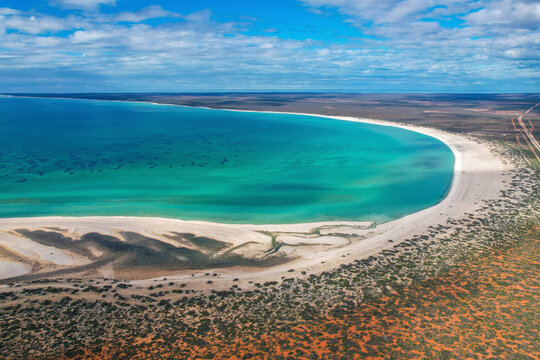 Aerial view of pristine Shell Beach with turquoise water and sandy shoreline, Shark Bay Conservation Park, Western Australia.