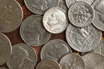 Pile with big amount of silver american cent coins as United States currency