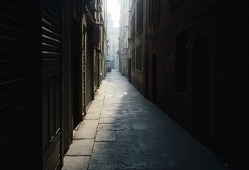 Fototapeta premium Narrow Alleyway With Old Brick Buildings And Cobblestone Pathway