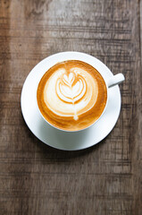 Latte Coffee on a Wooden Table A Warm Morning Moment
