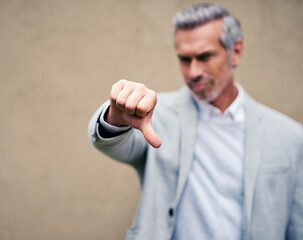 Hand, business man and thumbs down for fail, bad review or wrong investment outdoor. Dislike sign,...
