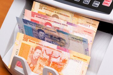 South African money in the counting machine