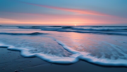 Empty Beach at Twilight with Gentle Waves Rolling Onto the Shore and a Pastel Sky