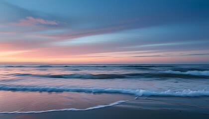 Empty Beach at Twilight with Gentle Waves Rolling Onto the Shore and a Pastel Sky