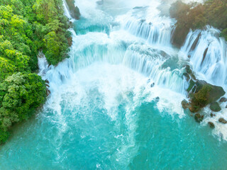 Aerial view of Ban Gioc Detian waterfall in Vietnam China border. The most beautiful and largest waterfall in Southeast Asia. © CravenA