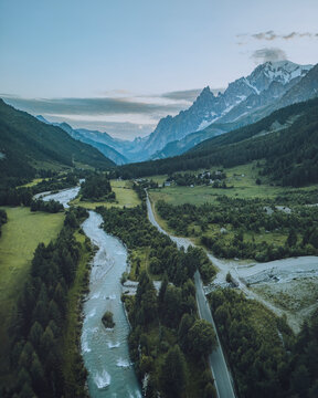 Aerial view of the majestic Val Ferret valley with Mont Blanc and the tranquil Dora di Ferret river, Courmayeur, Italy.