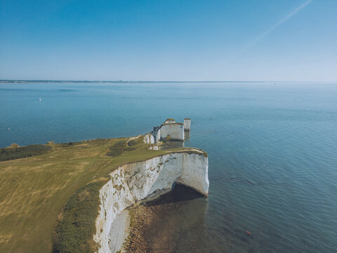 Aerial view of old harry rocks and chalk cliffs by the sea, swanage, united kingdom.