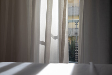 Soft light passing through curtains on a morning