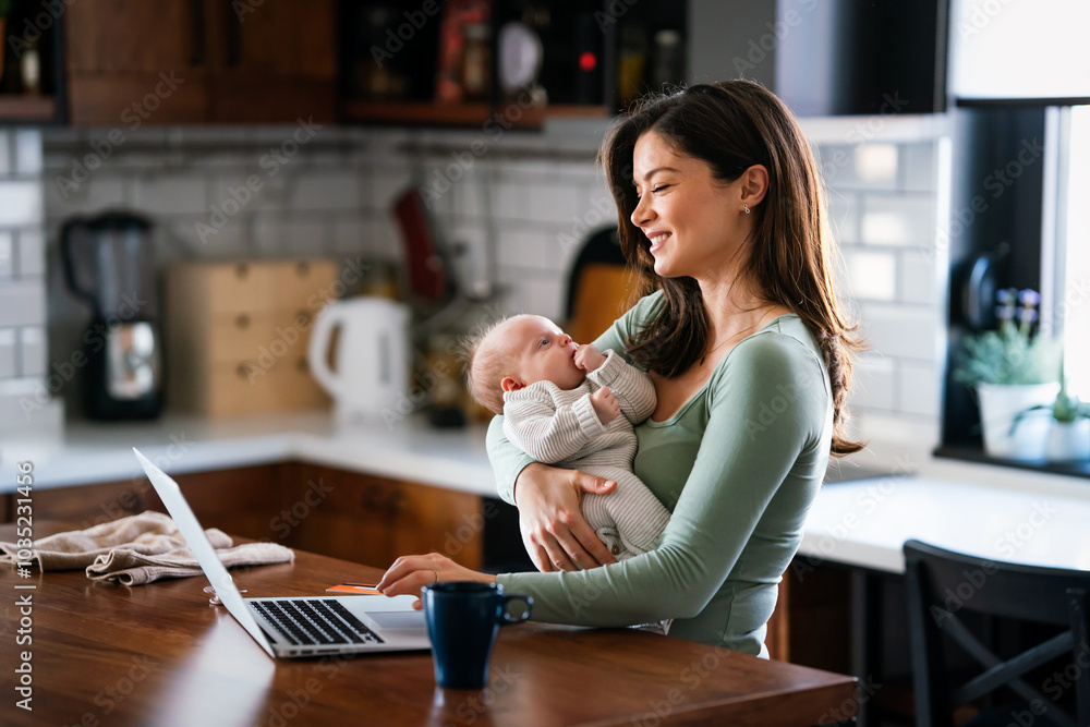 Poster Stay at home mom working remotely on laptop while taking care of her baby. Global work on computer