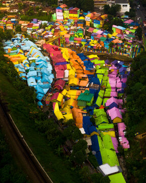 Aerial view of colorful houses and vibrant rooftops in a scenic neighborhood, Blimbing, East Java, Indonesia.