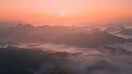 Orange sky and sea of clouds before sunrise. A peaceful, refreshing feeling. View of the hills surrounding Ba Quang, Ha Lang district, Cao Bang province, Vietnam