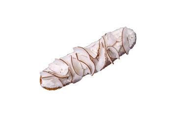 Sweet eclair with custard decorated with coconut slices