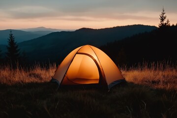 A glowing camping tent on a grassy mountain slope at dusk, with dark mountain silhouettes in the background, creating a peaceful and cozy atmosphere in the wilderness