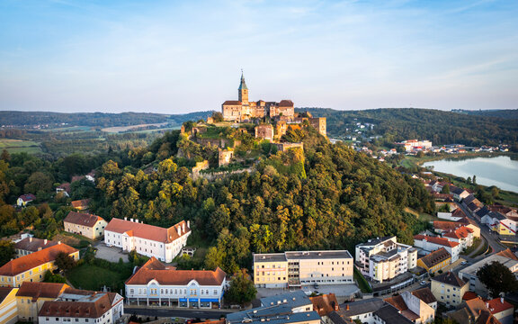 Aerial view of the beautiful medieval Burg Guessing castle surrounded by scenic greenery and rooftops, Guessing, Austria.