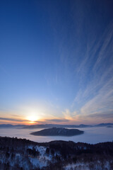 View of Lake Kussharo from Bihoro Pass in winter, Hokkaido, Japan /...