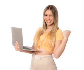 Portrait of a cheerful amazed young woman standing isolated over transparent background using laptop computer. Looking camera.