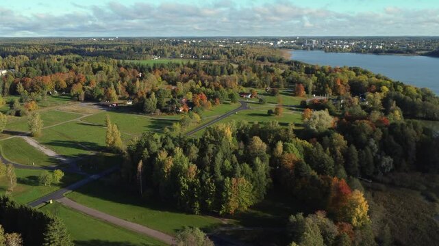 Flyover colorful autumn lakeside properties near Kerava, Finland