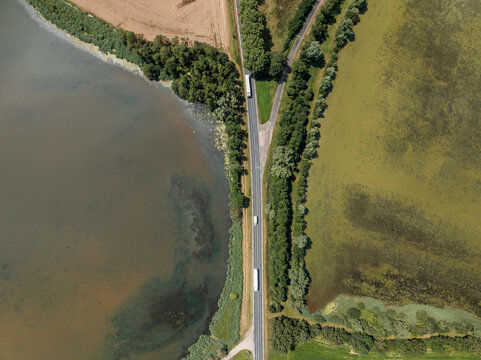 Aerial view of tranquil Parc des Oiseaux with serene lakes and lush greenery, Marlieux, France.
