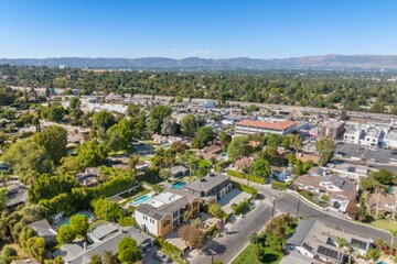 Aerial view of suburban neighborhood with mountains.