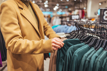 Person Shopping for Clothes in a Fashion Retail Store