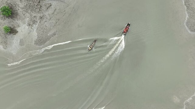Aerial view of moving boats on the beautiful Bodo River, Port Harcourt, Nigeria.