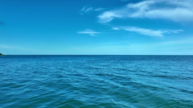 Nature of the beach and sea Summer with sunshine, sandy beaches, clear blue waters sparkling against the blue sky. On an island with good ecology and environment Background for summer vacation concept