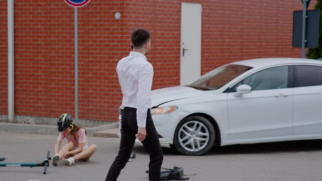 Businessman makes urgent phone call to police near wrecked car