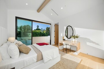 Fototapeta premium Modern bedroom with minimalist decor and greenery view.