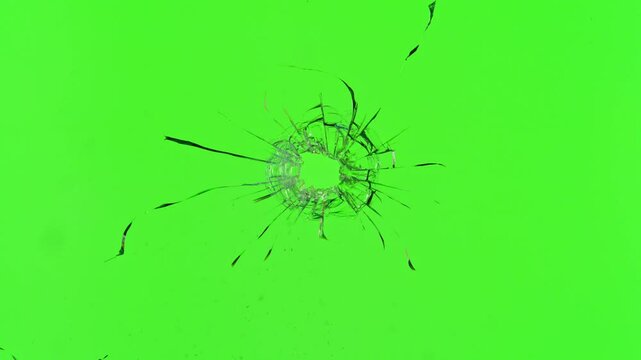Super slow motion of gunshot through the glass, shattering against green screen background . Filmed on high speed cinema camera, 1000 fps.