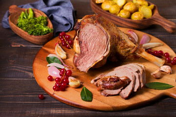 Roasted leg of lamb on serving board