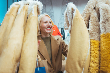 Happy Woman Shopping For Cozy Winter Coats in Fashion Store