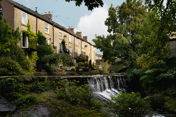 Fototapeta premium Stone houses by River Sett and waterfall