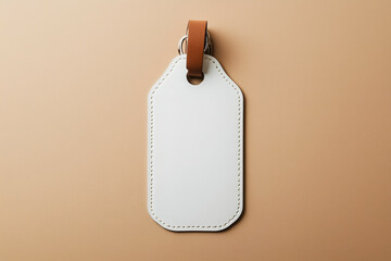 A blank leather luggage tag with a brown strap resting on a neutral surface for labeling travel bags or personal items. Generative AI