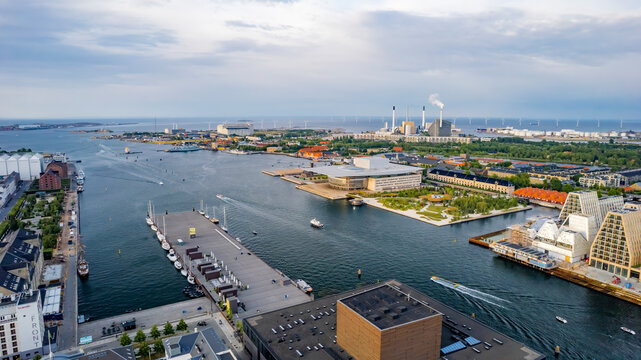 Aerial view of operapark and copenhill by the canal with boats in the harbour, copenhagen, denmark.