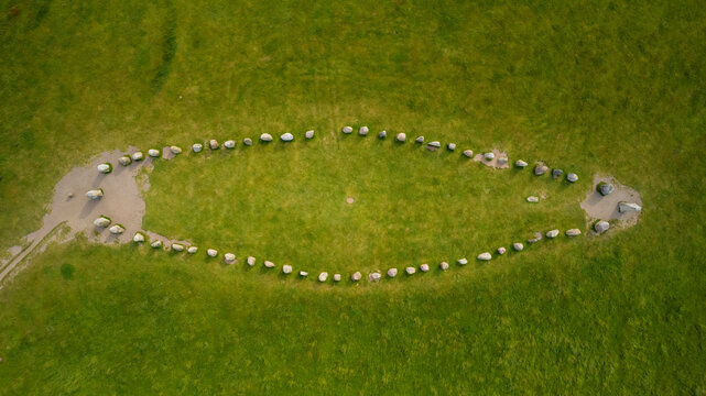 Aerial view of ales stenar stone monument in a tranquil meadow, ystad, sweden.