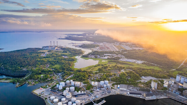 Aerial view of industrial harbour with boats and canal at sunset, Karlshamn Citadel, Sweden.