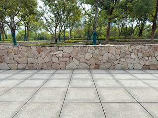 Tranquil Outdoor Scene Featuring Stone Wall and Pavement