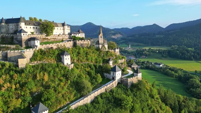 Aerial view of hochosterwitz castle fortress on a hilltop surrounded by scenic greenery and valleys, St. Veit, Austria.