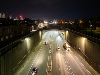 Fototapeta premium Cars driving on the highway at night in liverpool