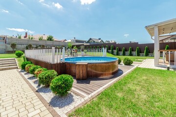 Cozy Backyard with Elevated Pool and Green Garden