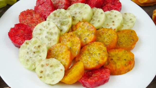 Sliced ​​cactus on a plate.