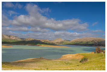 Scenic Beauty of Kasseb Dam: A Majestic View of Mountains and Lake in Bousalem, Beja, Tunisia,...