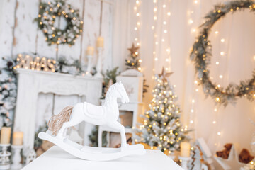 Beautifully illuminated Christmas decoration with sparkling lights, Christmas trees, stars, teddy bears and presents.	
