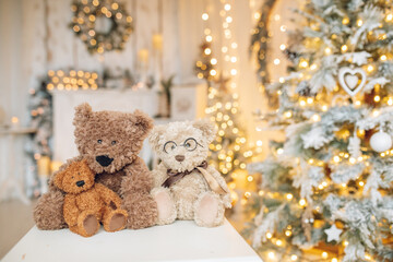 Beautifully illuminated Christmas decoration with sparkling lights, Christmas trees, stars, teddy bears and presents.	
