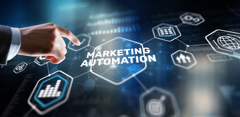 Marketing automation on the virtual screen. Man clicks on the inscription Marketing