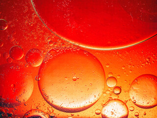 Abstract Background Red oil Macro Colorful artistic of oil drop floating on the water. macro red bubble oil of wallpeper, blood concept