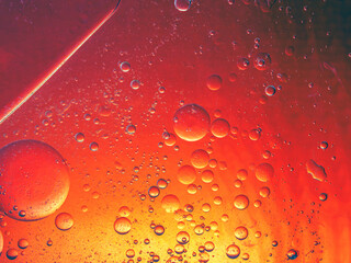Abstract Background Red oil Macro Colorful artistic of oil drop floating on the water. macro red bubble oil of wallpeper, blood concept