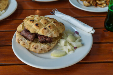 Traditional grilled meat sandwich with onions